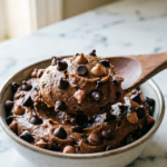 Bowl of edible chocolate chip cookie dough with a spoon